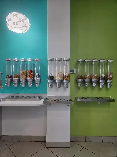 Wall-mounted candy and cereal topping dispensers